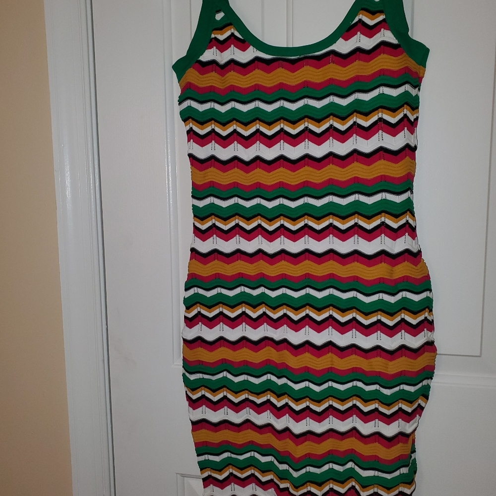 Beautiful figure flattering knit dress. Size medium